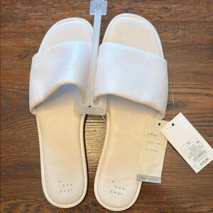 Elegant White Slide Sandals with Cushioned Sole and Adjustable Straps